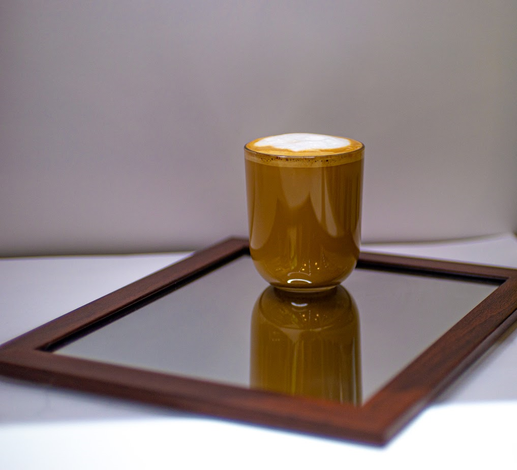 Photo of coffee on a mirror