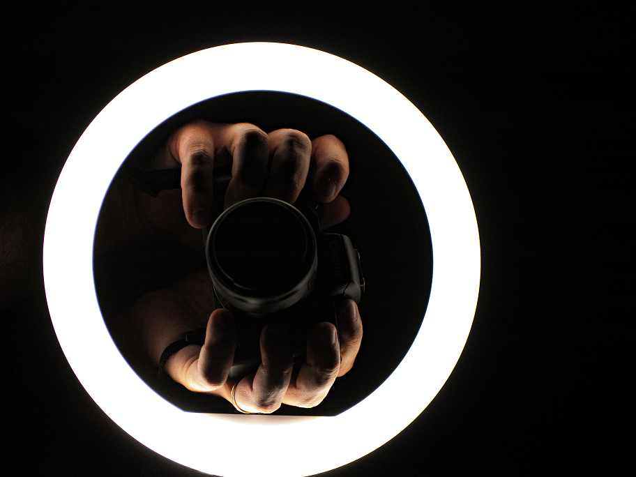Photograph of hands holding a camera