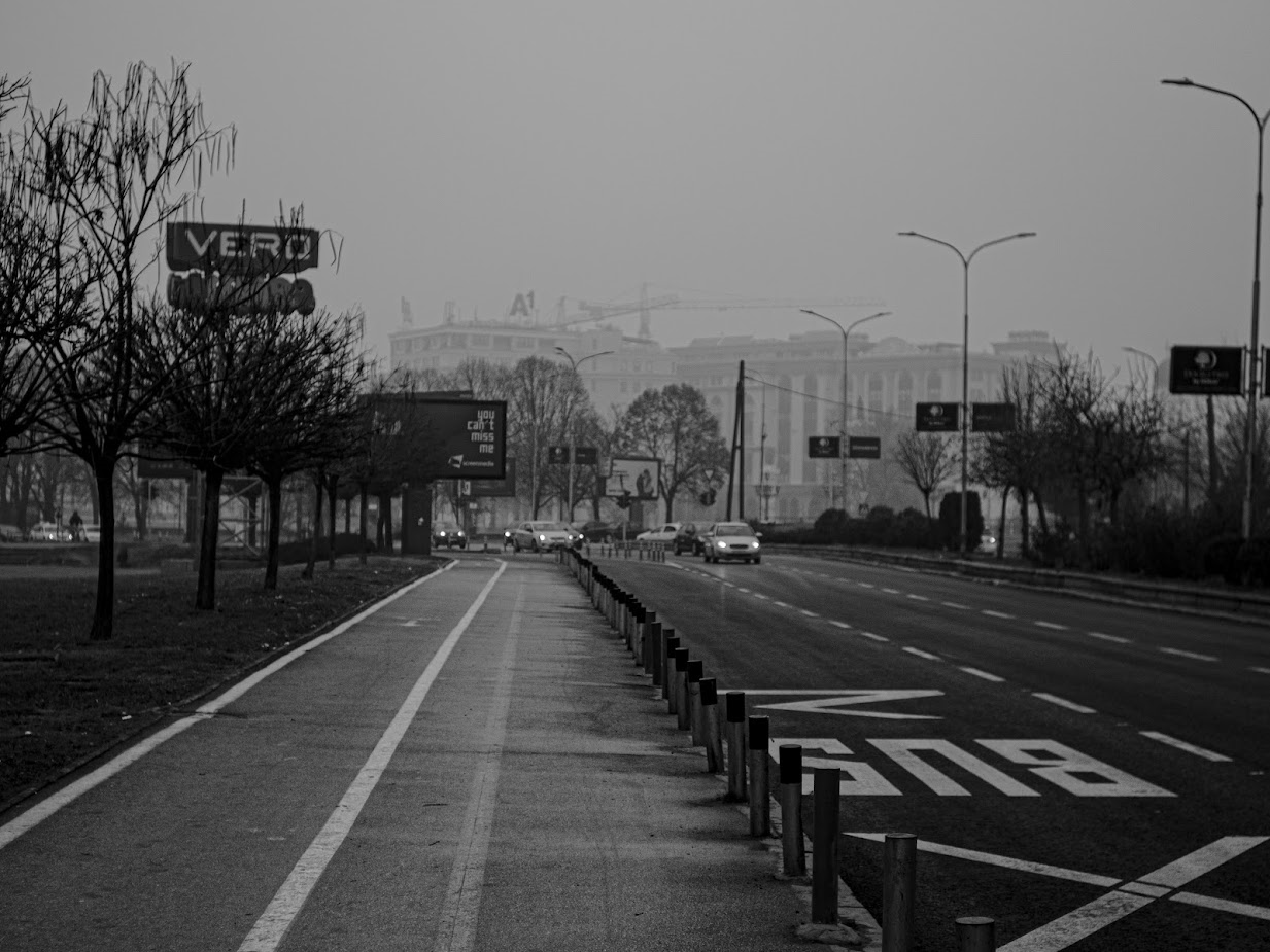 Photo of a city srteet with traffic incoming