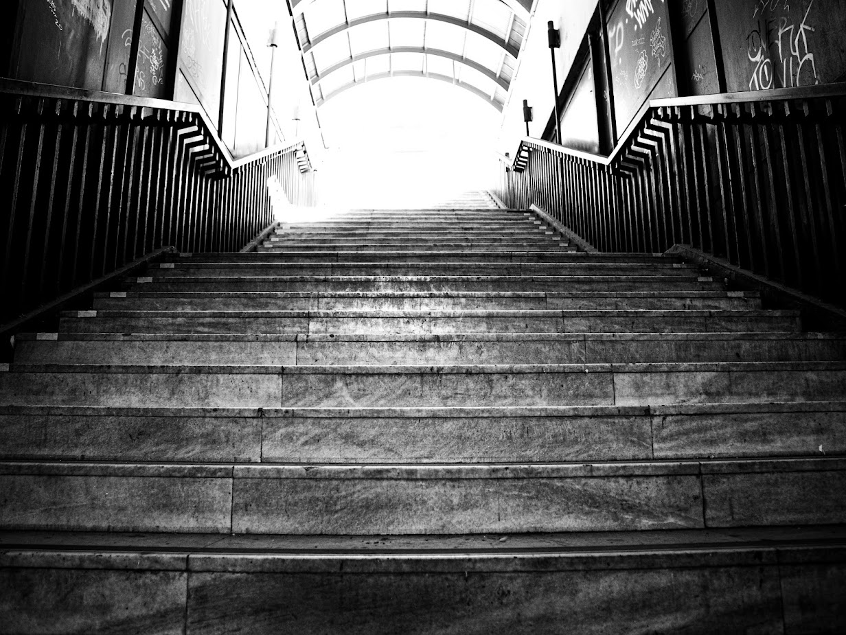Photo of stairs going towards the light